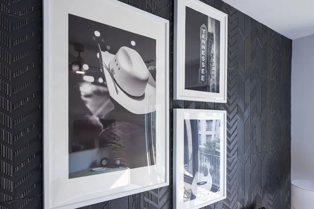 a bedroom with a bed and a lamp on table