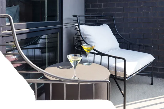 an aerial view of residential houses with city view