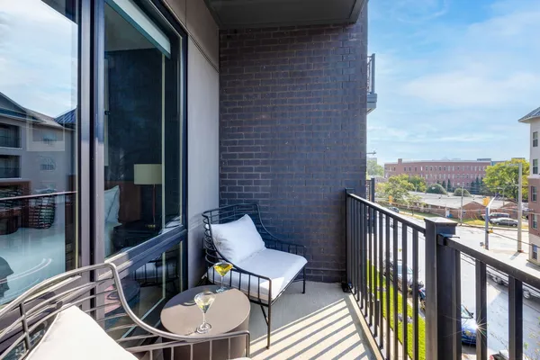 a view of a balcony with furniture