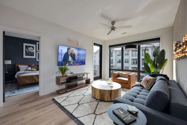 a living room with furniture and a large window