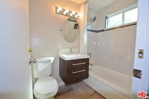 a bathroom with a toilet sink and a bathtub