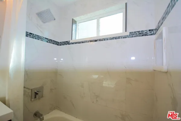 a bathroom with a shower and a toilet