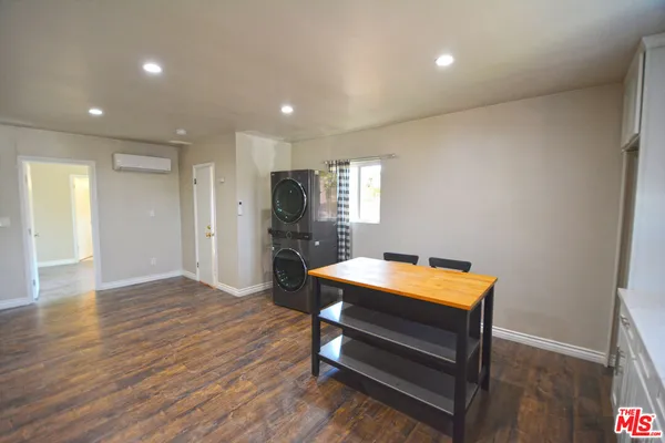 a room with furniture and wooden floor