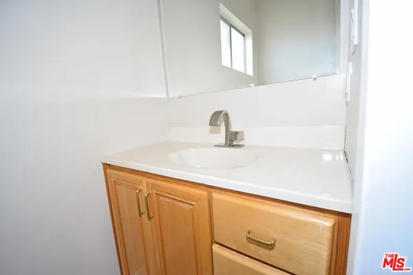a close view of a sink and a vanity in the bathroom