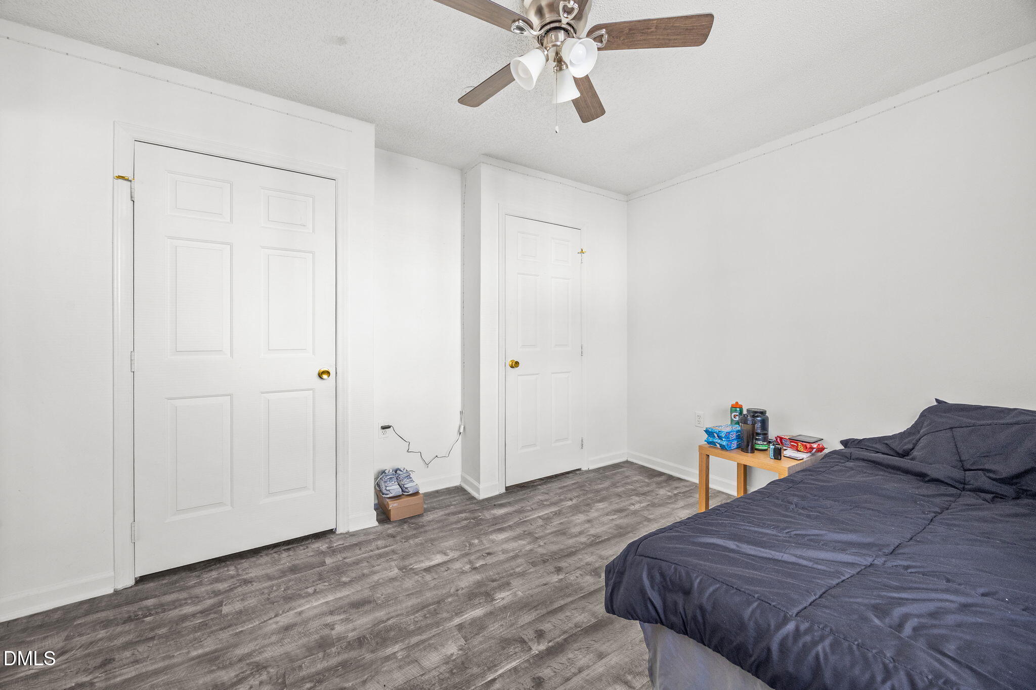 1305 Kent Road, Unit 101 Raleigh, NC 27606 - Photo 11 of 29 a bedroom with a bed and a chandelier