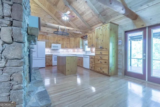 a view of a room with wooden floor and balcony
