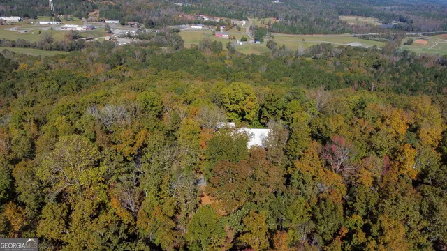 a view of a house with a yard and garage