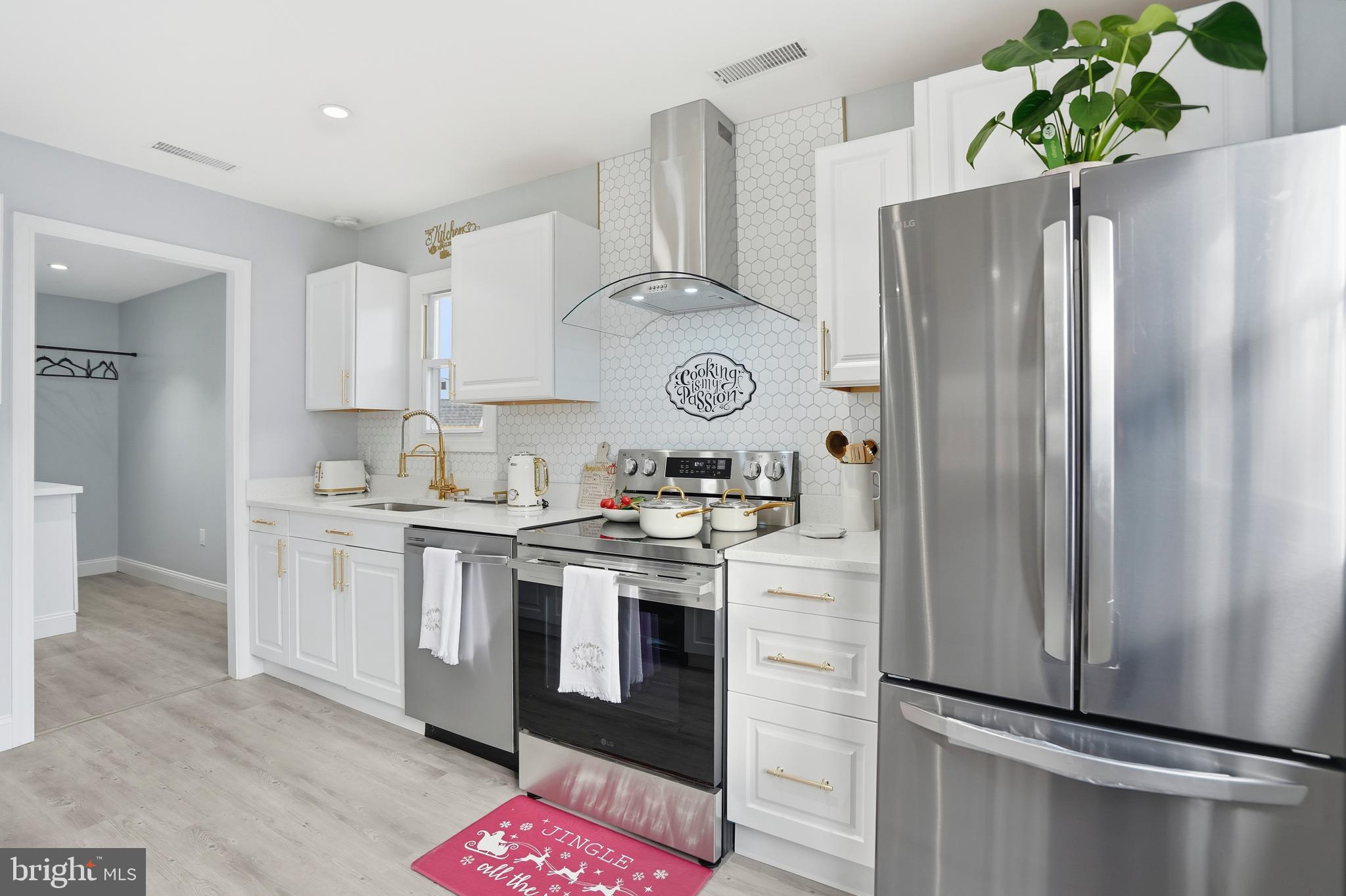 605 Sequoia Drive Edgewood, MD 21040 - Photo 9 of 28 a kitchen with stainless steel appliances granite countertop a refrigerator a stove a sink and white cabinets