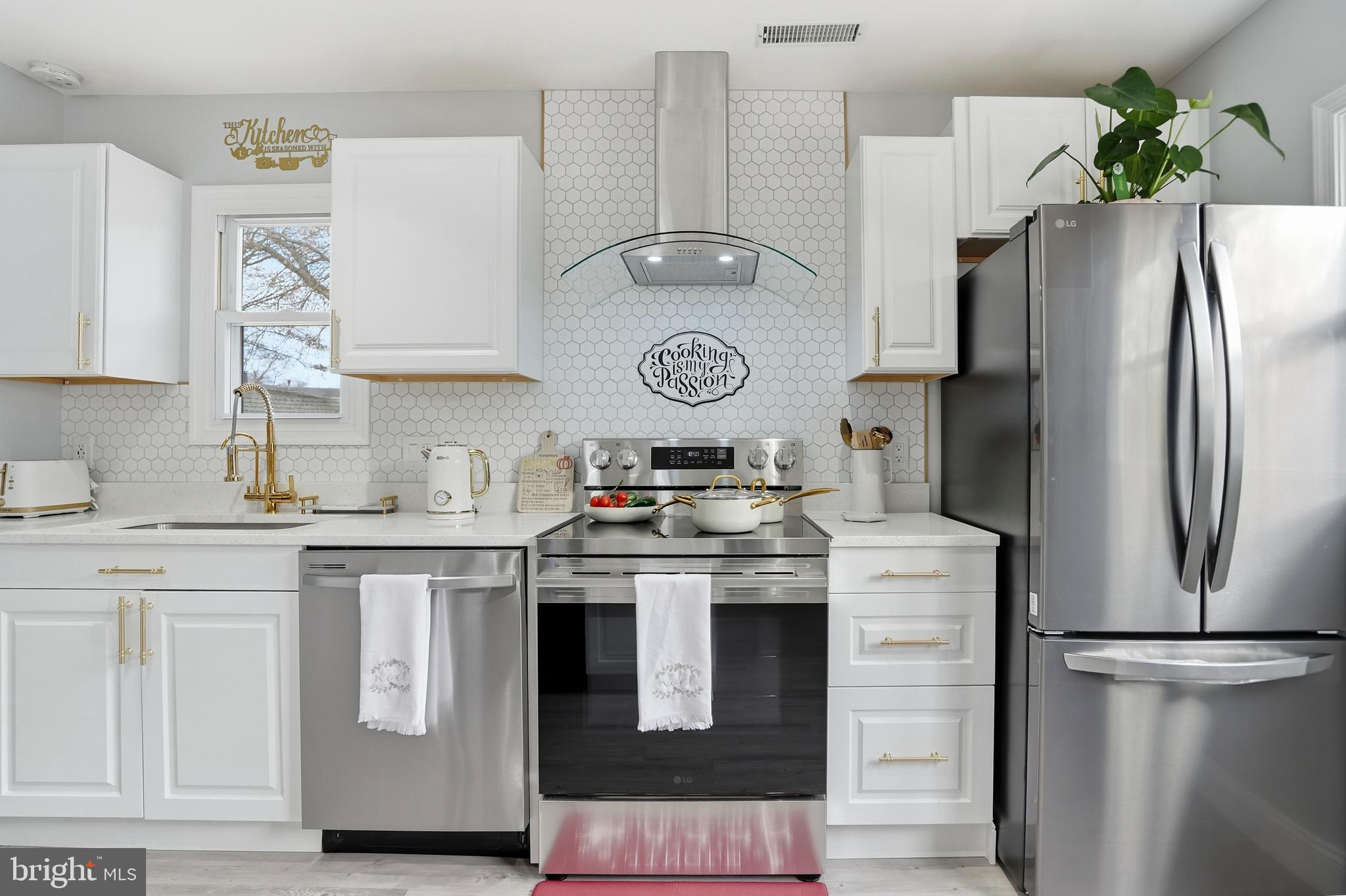 605 Sequoia Drive Edgewood, MD 21040 - Photo 10 of 28 a kitchen with stainless steel appliances granite countertop a refrigerator a stove and a sink