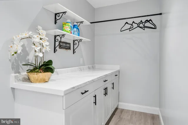 a view of a hallway with washer and dryer