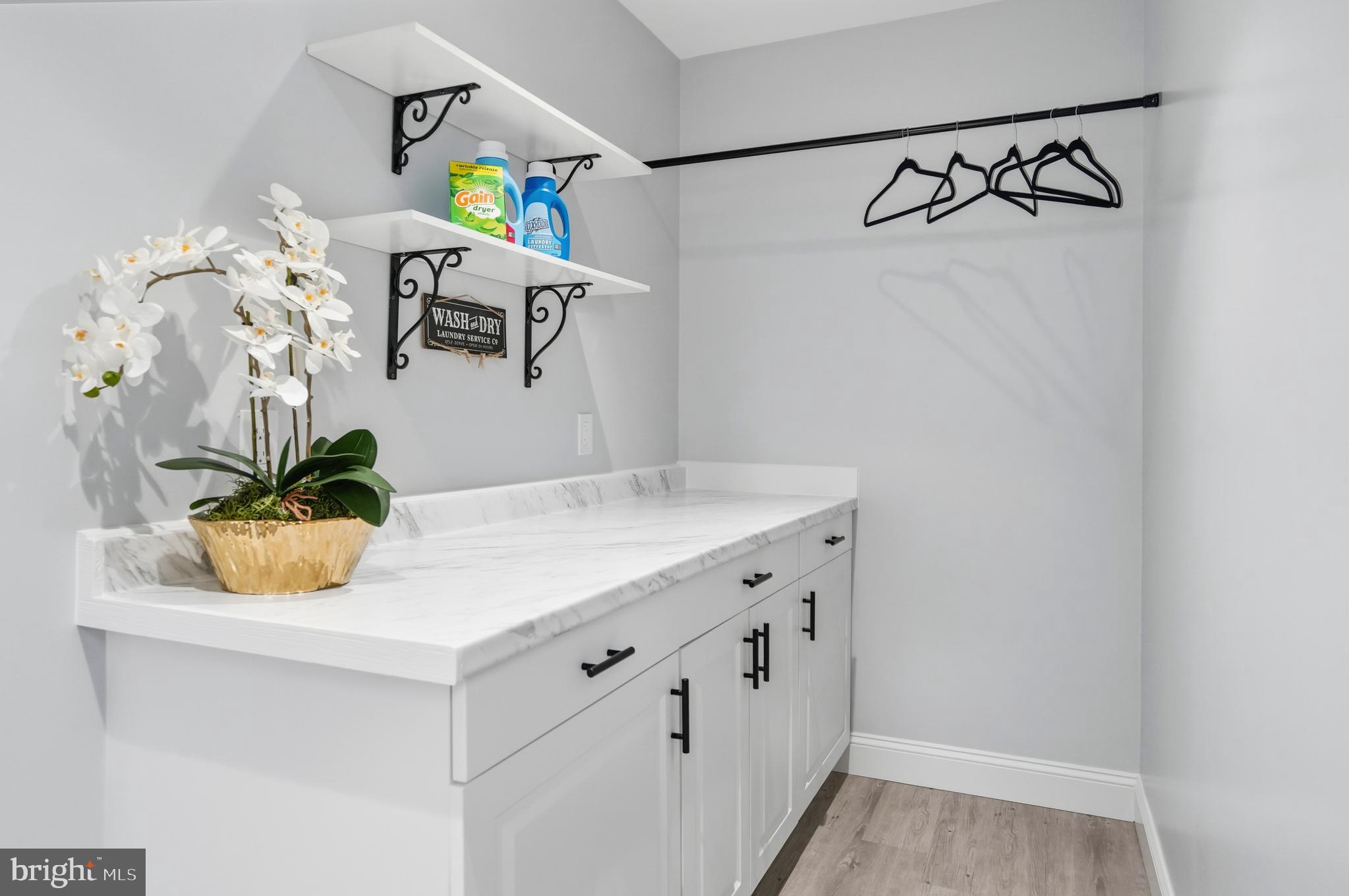 605 Sequoia Drive Edgewood, MD 21040 - Photo 15 of 28 a bathroom with a sink a mirror and painting on the wall