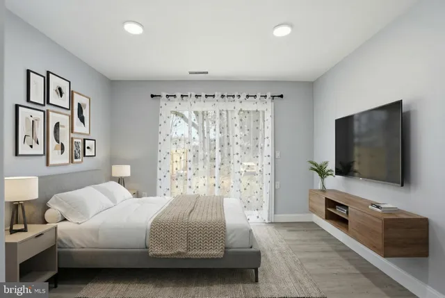 a bathroom with a sink a mirror and painting on the wall