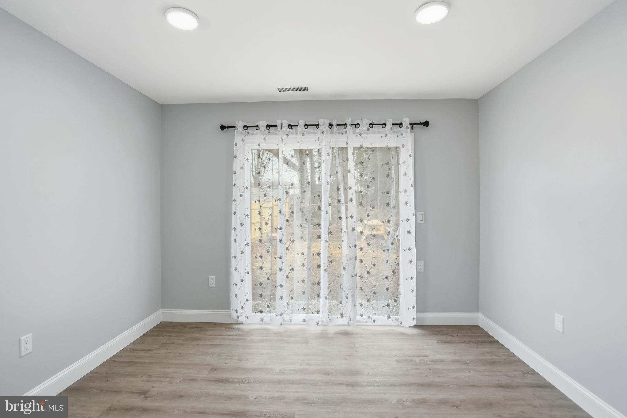 605 Sequoia Drive Edgewood, MD 21040 - Photo 17 of 28 an empty room with wooden floor and a window