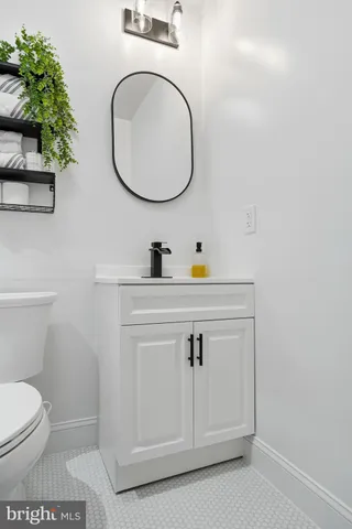 an empty room with wooden floor and closet