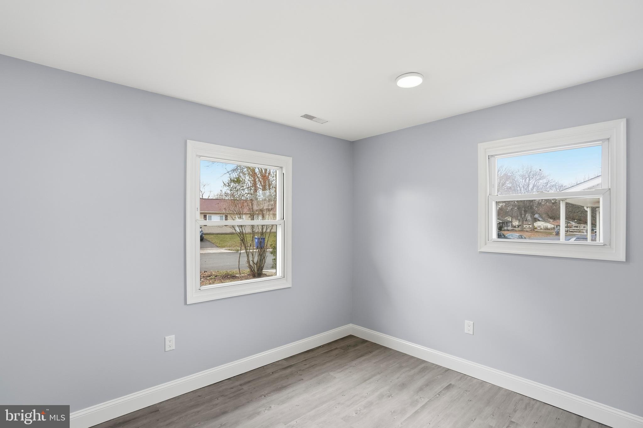 605 Sequoia Drive Edgewood, MD 21040 - Photo 22 of 28 a view of an empty room with a window and wooden floor