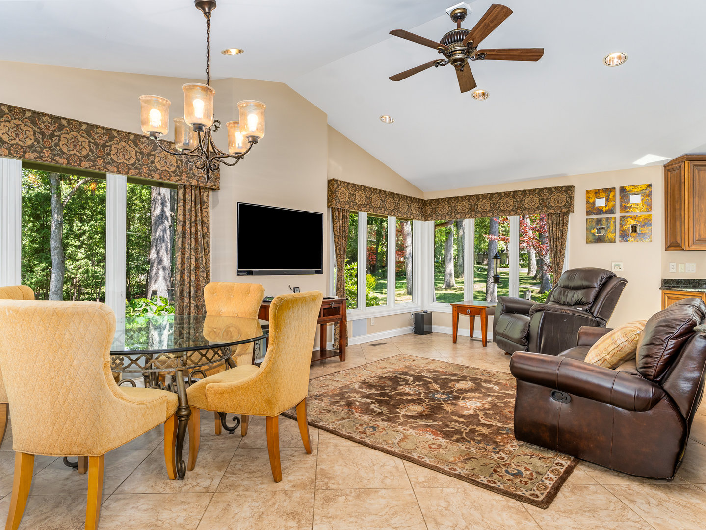 12 Arrowhead Lane DeKalb, IL 60115 - Photo 12 of 55 a living room with furniture a chandelier and a flat screen tv