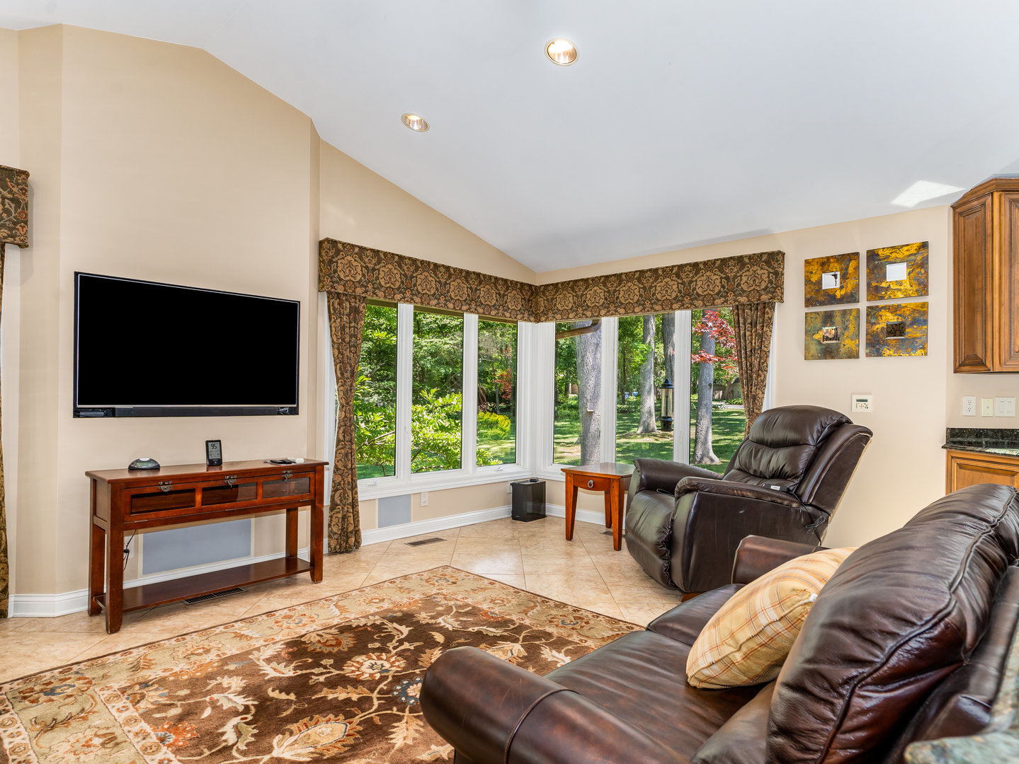 12 Arrowhead Lane DeKalb, IL 60115 - Photo 13 of 55 a living room with furniture and a flat screen tv