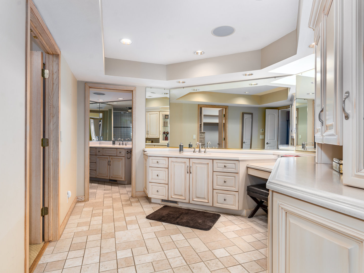 12 Arrowhead Lane DeKalb, IL 60115 - Photo 22 of 55 a large bathroom with a double vanity sink a mirror and a bathtub