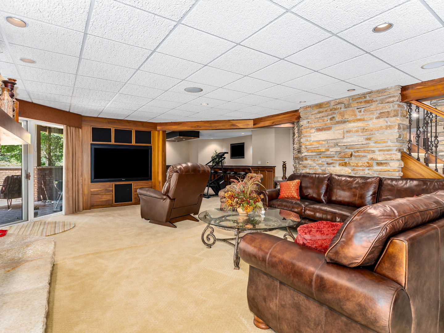 12 Arrowhead Lane DeKalb, IL 60115 - Photo 34 of 55 a living room with furniture a flat screen tv and a large window