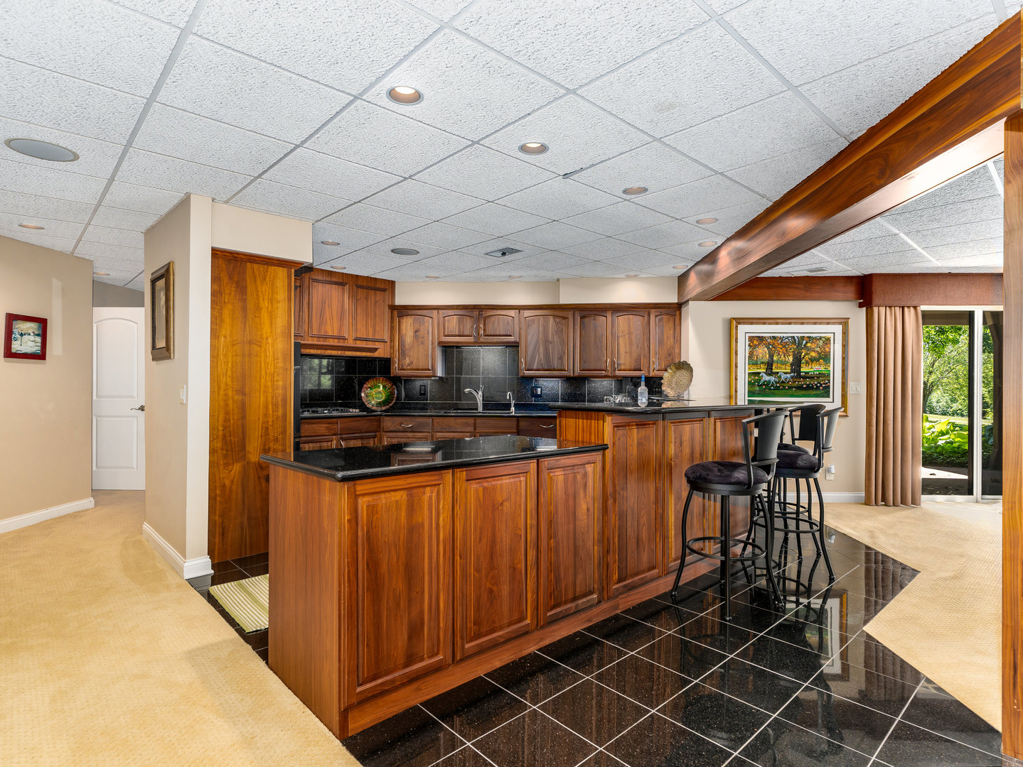 12 Arrowhead Lane DeKalb, IL 60115 - Photo 35 of 55 a kitchen with stainless steel appliances granite countertop a table chairs and a refrigerator