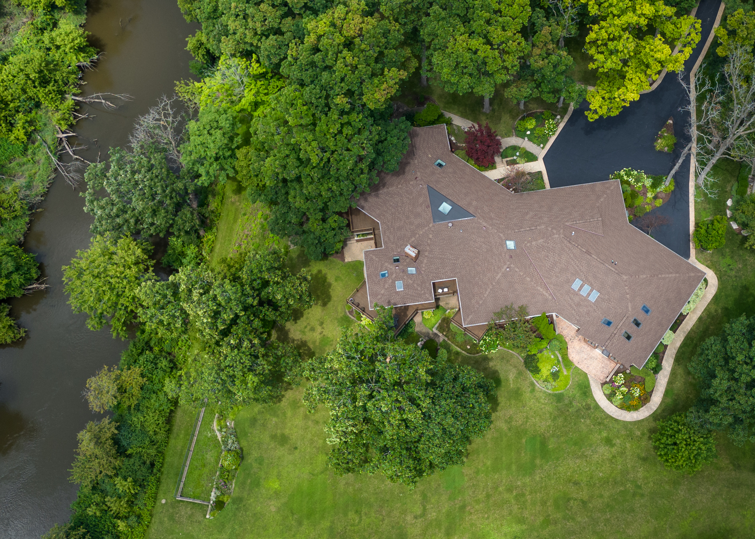 12 Arrowhead Lane DeKalb, IL 60115 - Photo 52 of 55 an aerial view of a house with swimming pool and garden