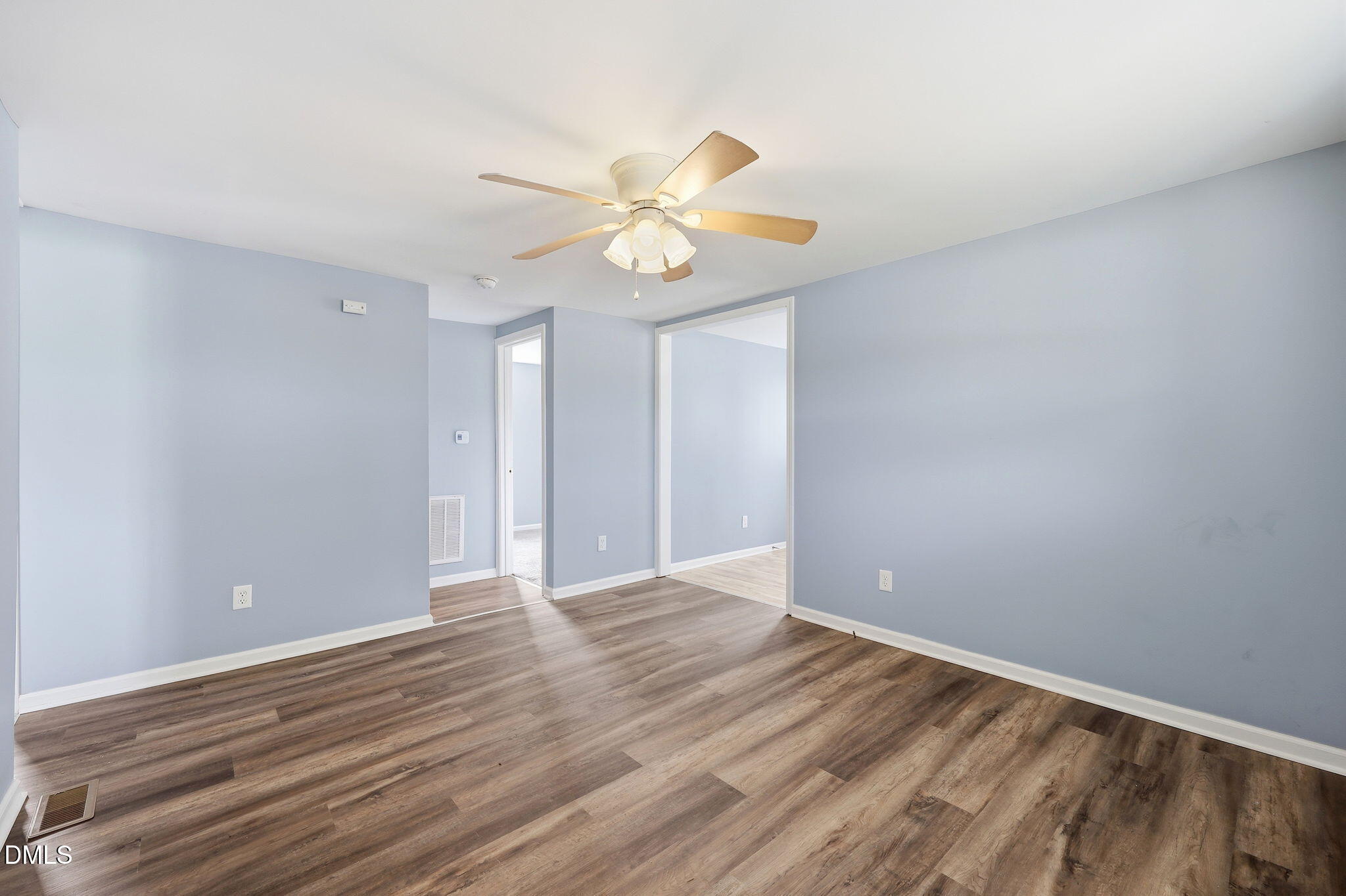 1758 Barber Mill Road Clayton, NC 27520 - Photo 7 of 41 a view of an empty room with window and wooden floor