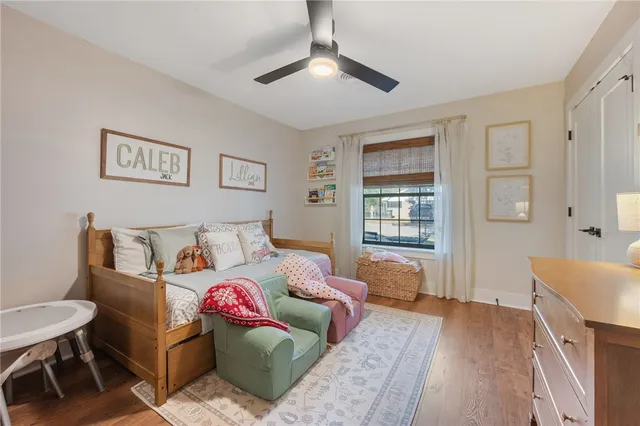 a spacious bedroom with a bed and a couch