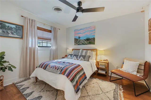 a bedroom with a bed and a couch