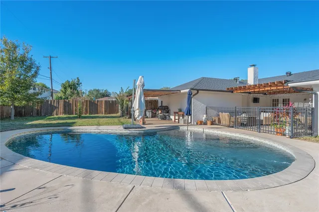 a view of a house with swimming pool