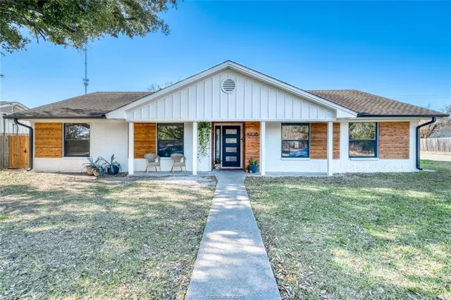 a picture of a room with a white wall and white cabinet