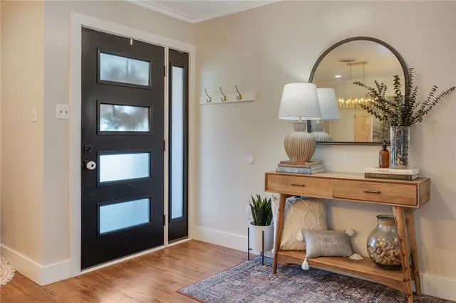 a living room with a table and chairs