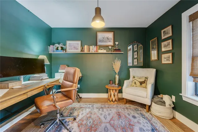 a workspace with furniture and wooden floor