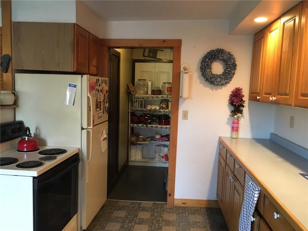 7 Dustin Street Dexter, ME 04930 - Photo 6 of 23 Kitchen view looking into pantry...