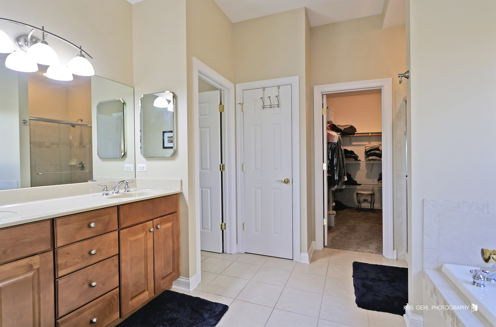 1265 Bayshore Drive Antioch, IL 60002 - Photo 15 of 42 a spacious bathroom with a double vanity sink a mirror and a shower