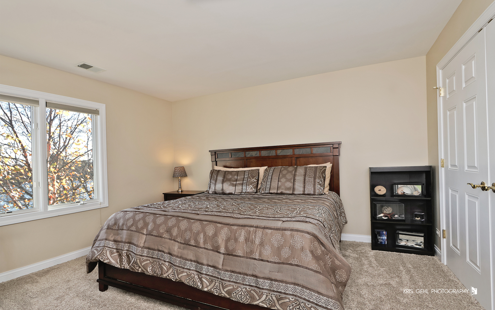 1265 Bayshore Drive Antioch, IL 60002 - Photo 24 of 42 a bedroom with a bed next to a window and a larger closet