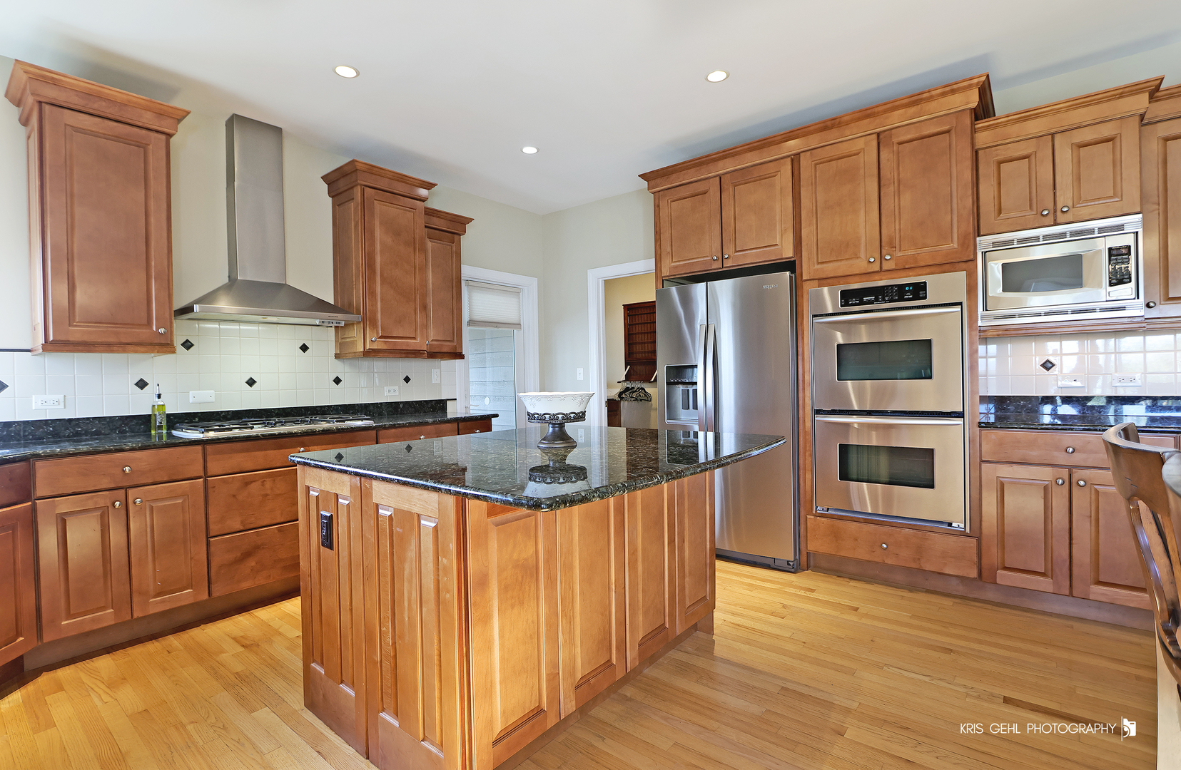 1265 Bayshore Drive Antioch, IL 60002 - Photo 6 of 42 a kitchen with stainless steel appliances granite countertop a refrigerator a stove top oven and a sink