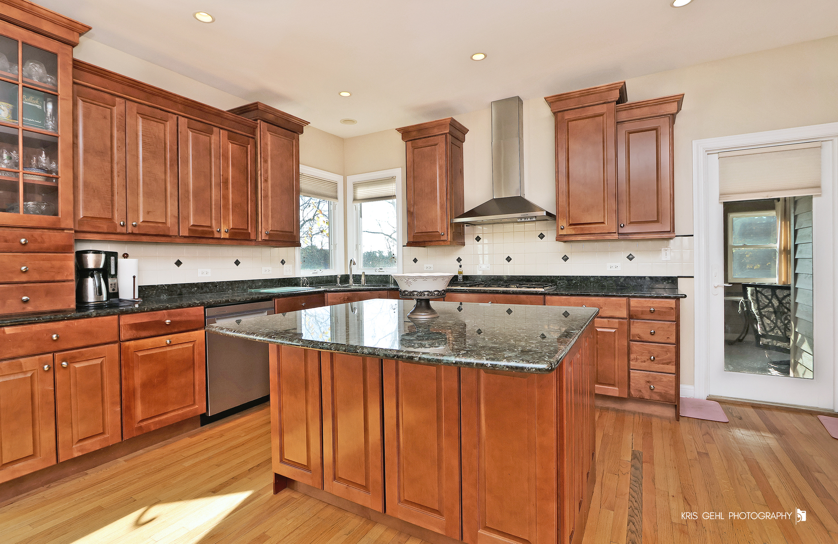 1265 Bayshore Drive Antioch, IL 60002 - Photo 7 of 42 a kitchen with granite countertop a sink dishwasher stove and cabinets