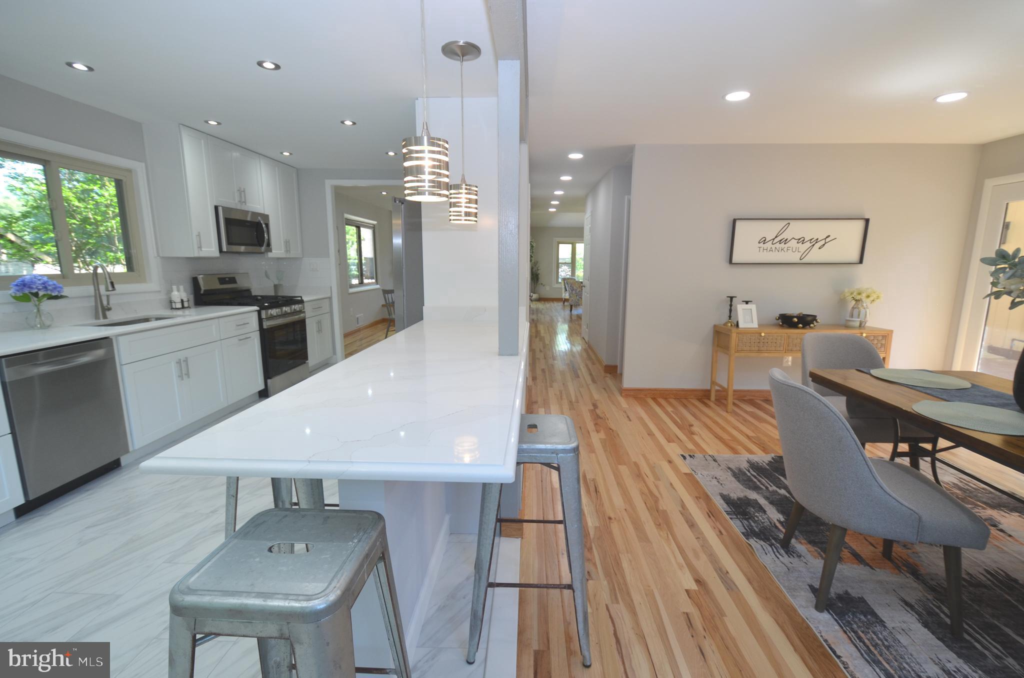 10601 Fiesta Road Fairfax, VA 22032 - Photo 15 of 58 a large kitchen with a table and chairs