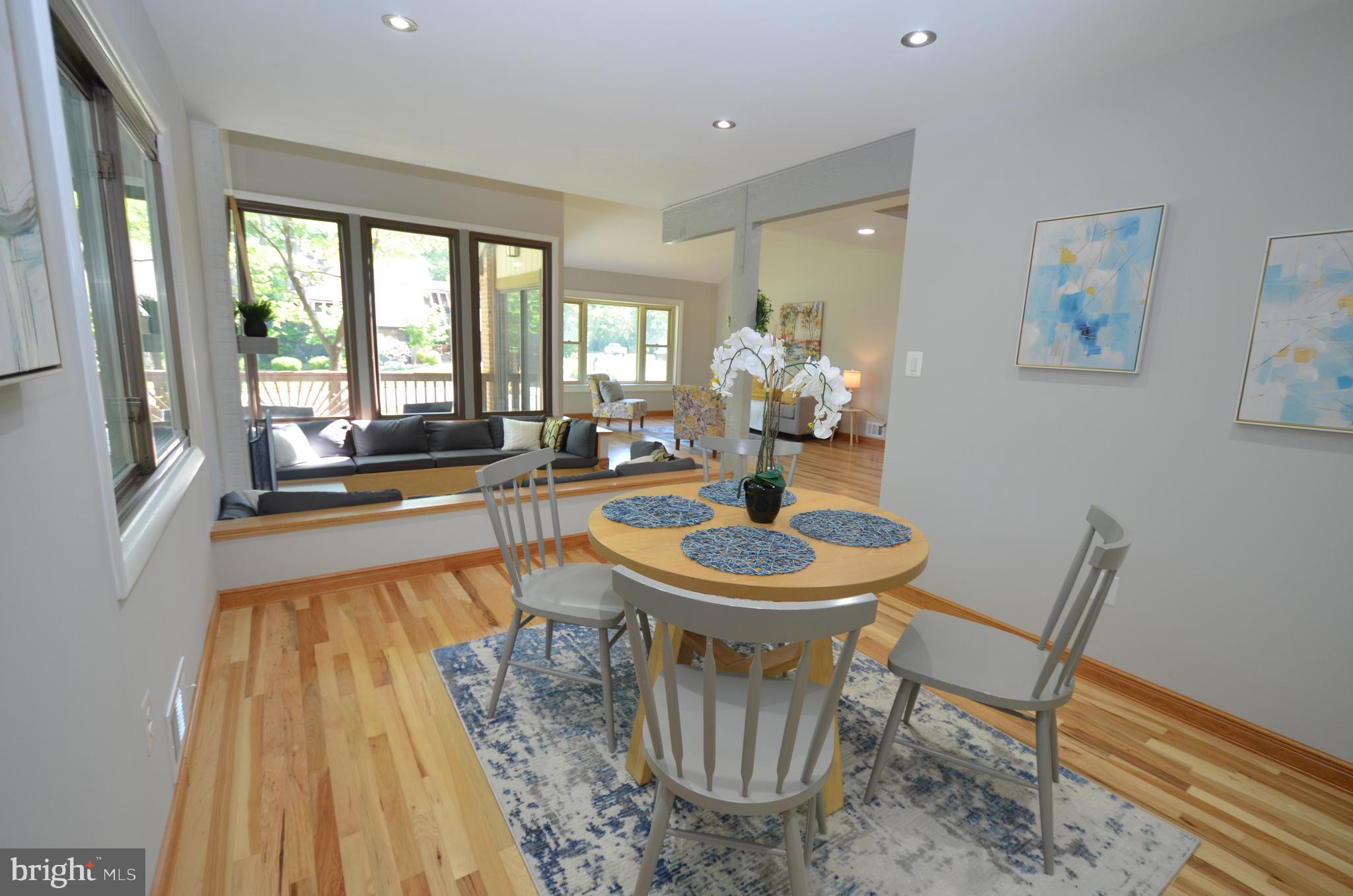 10601 Fiesta Road Fairfax, VA 22032 - Photo 57 of 58 a dining room with furniture a rug and wooden floor