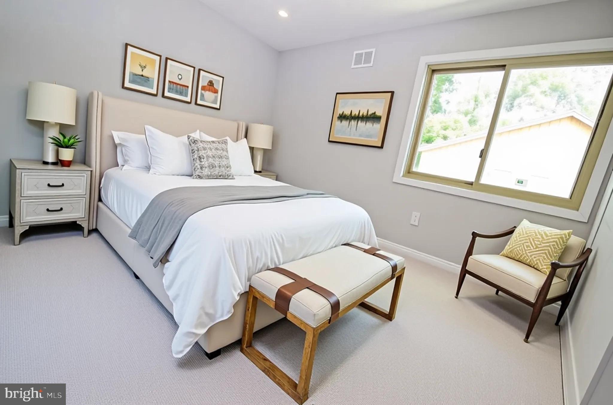 10601 Fiesta Road Fairfax, VA 22032 - Photo 24 of 58 a bedroom with a bed and a couch next to a window
