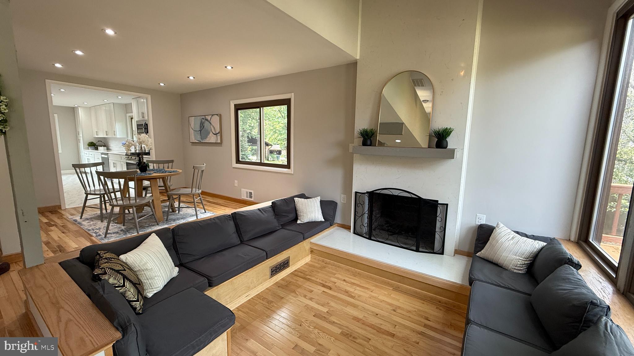 10601 Fiesta Road Fairfax, VA 22032 - Photo 27 of 58 a living room with furniture and a fireplace