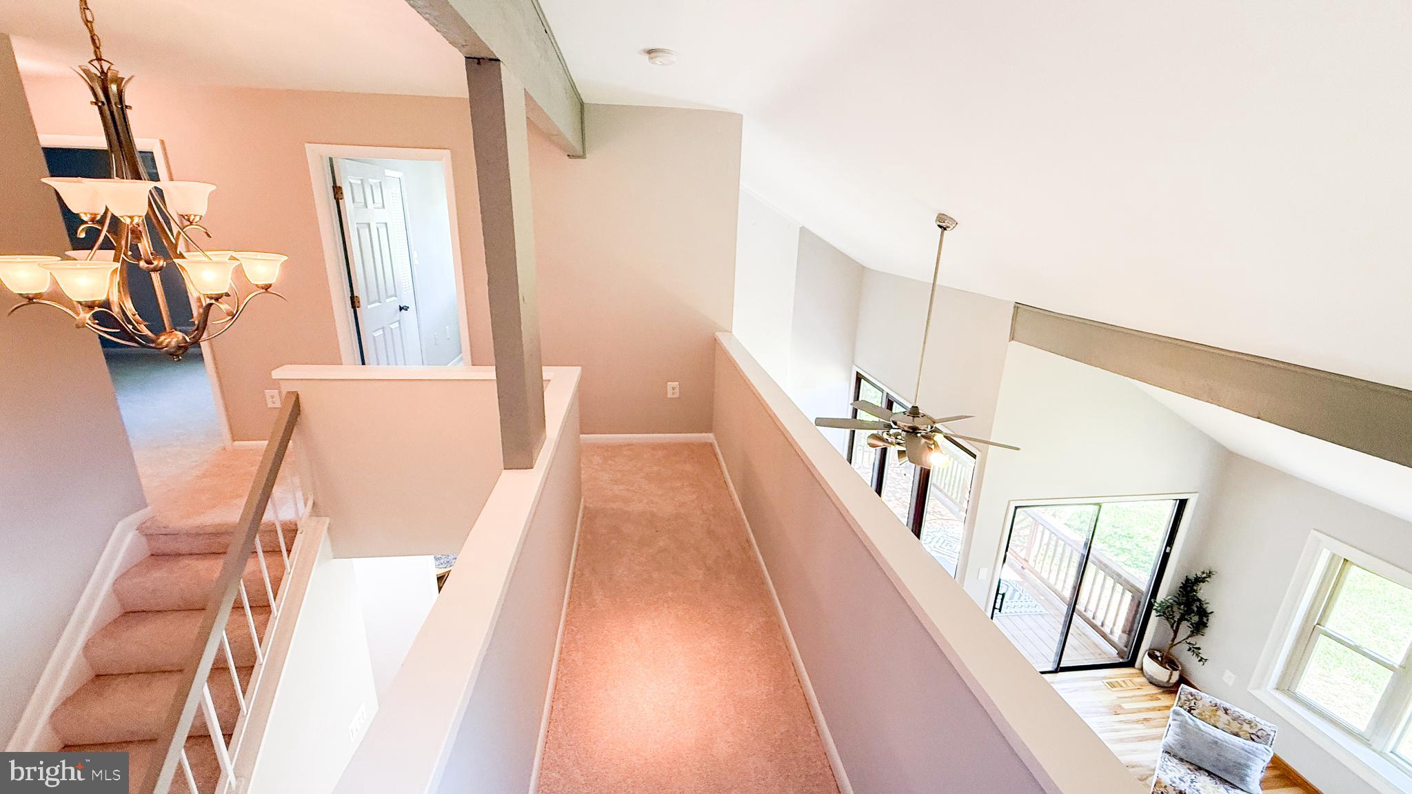 10601 Fiesta Road Fairfax, VA 22032 - Photo 33 of 58 a view of a hallway with wooden floor and staircase