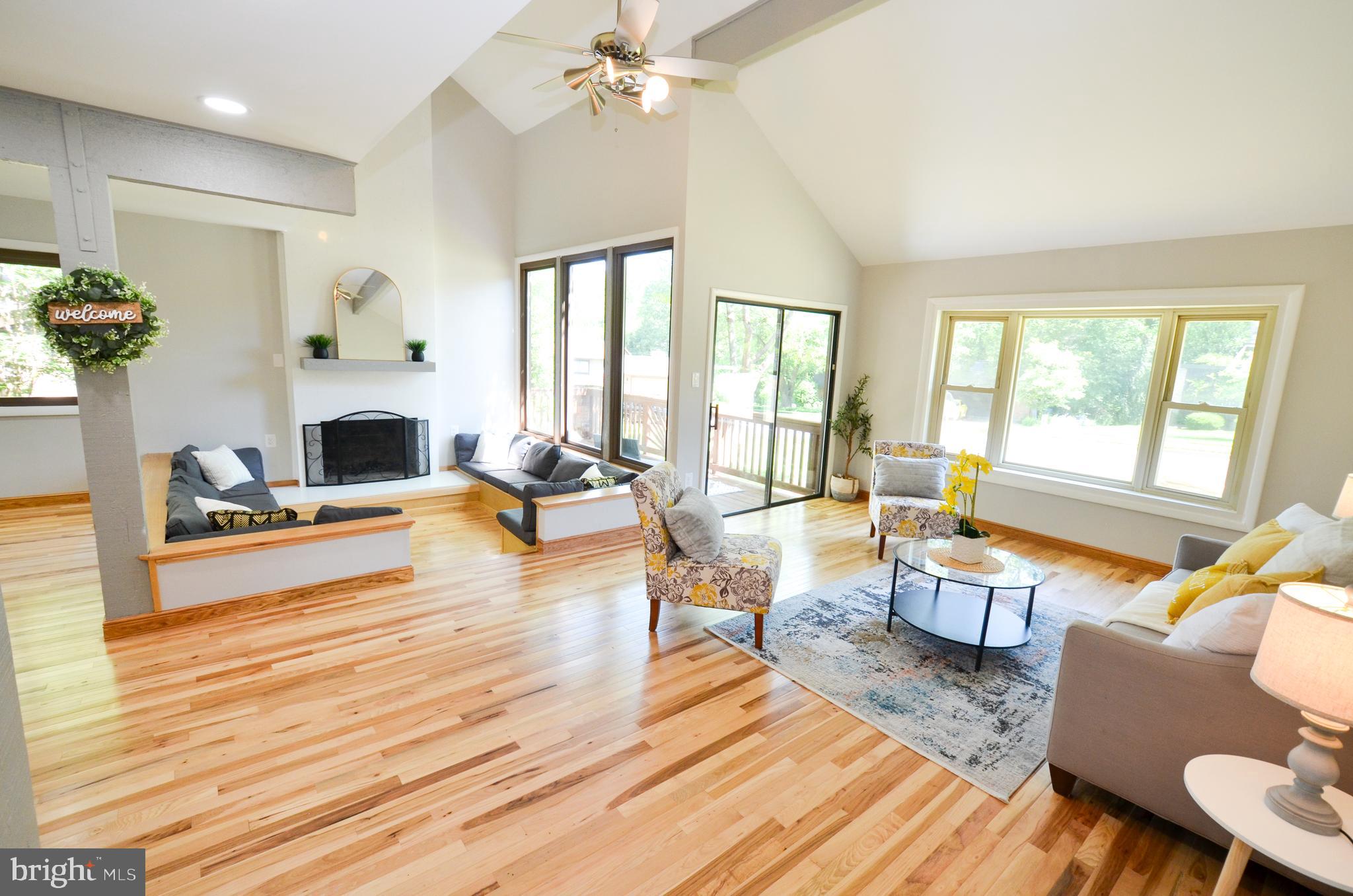 10601 Fiesta Road Fairfax, VA 22032 - Photo 3 of 58 a living room with fireplace furniture and a large window