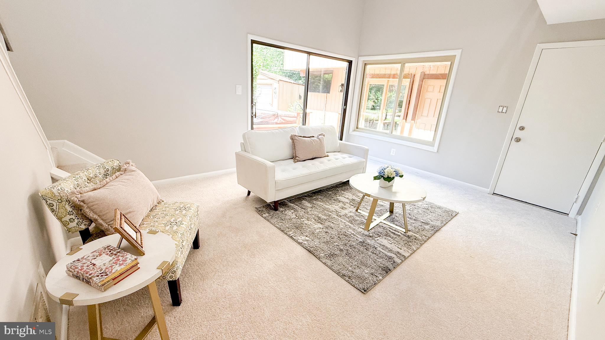 10601 Fiesta Road Fairfax, VA 22032 - Photo 40 of 58 a living room with furniture and a window