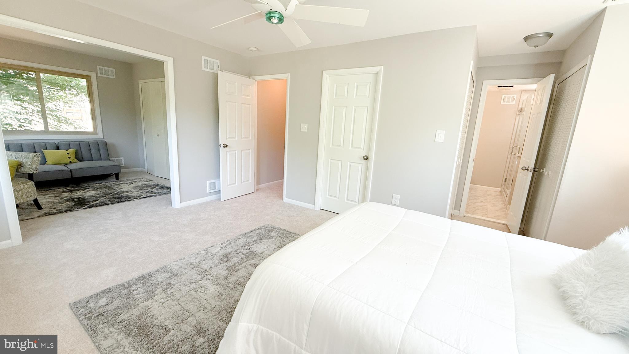 10601 Fiesta Road Fairfax, VA 22032 - Photo 43 of 58 a spacious bedroom with a bed and a large window