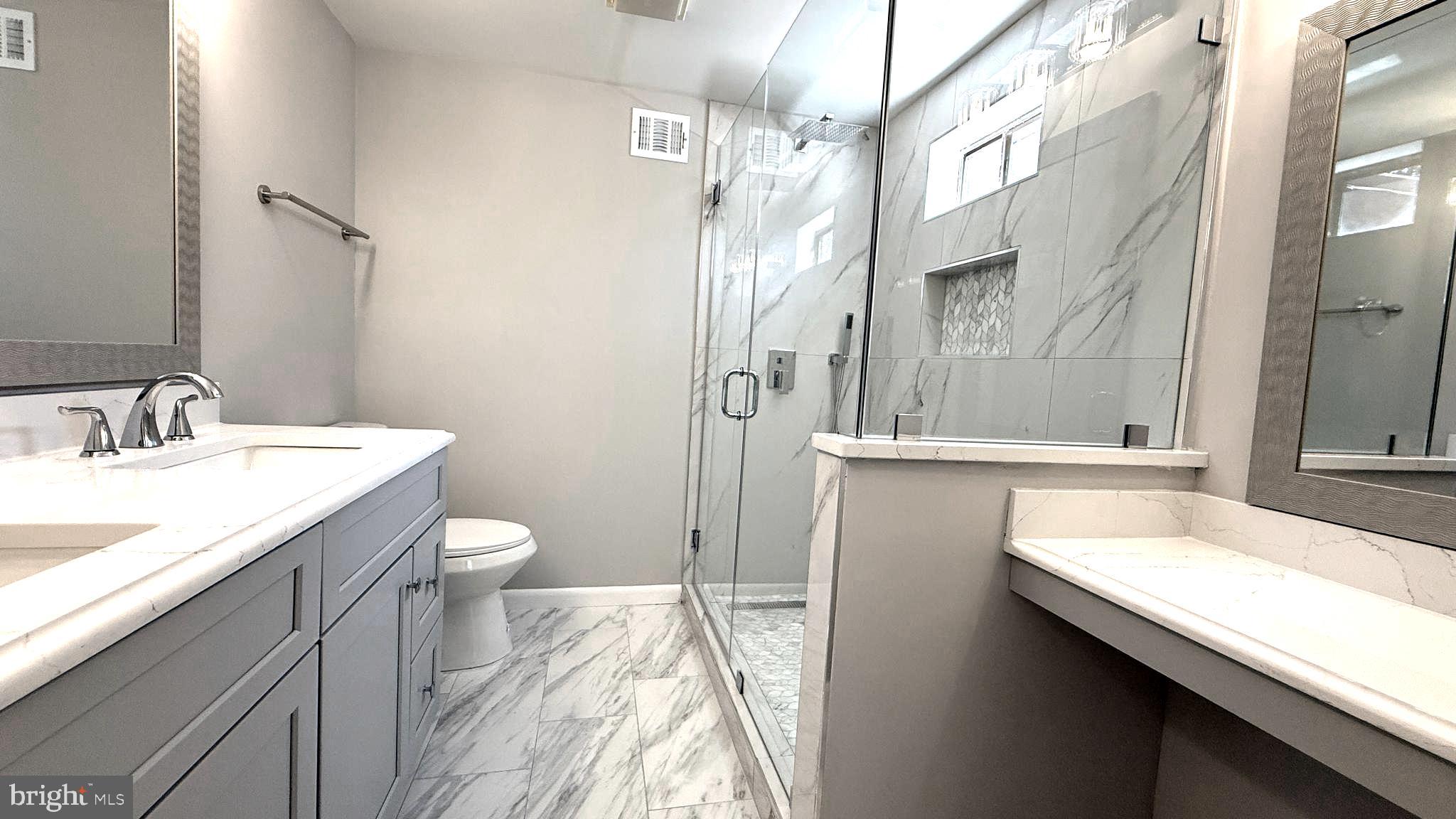 10601 Fiesta Road Fairfax, VA 22032 - Photo 46 of 58 a bathroom with a sink and a mirror