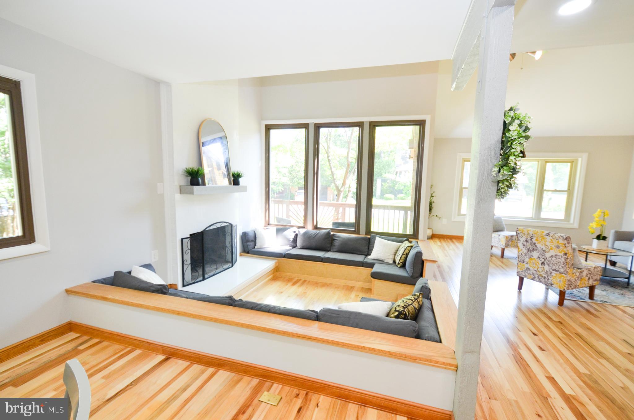 10601 Fiesta Road Fairfax, VA 22032 - Photo 4 of 58 a living room with furniture fireplace and a table