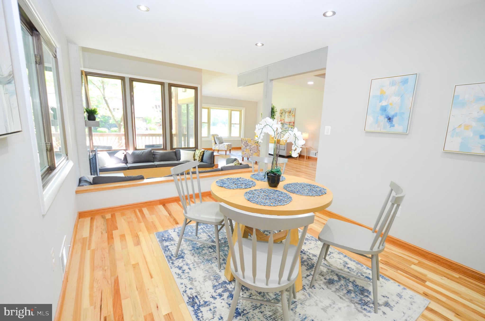 10601 Fiesta Road Fairfax, VA 22032 - Photo 5 of 58 a dining room with furniture and wooden floor