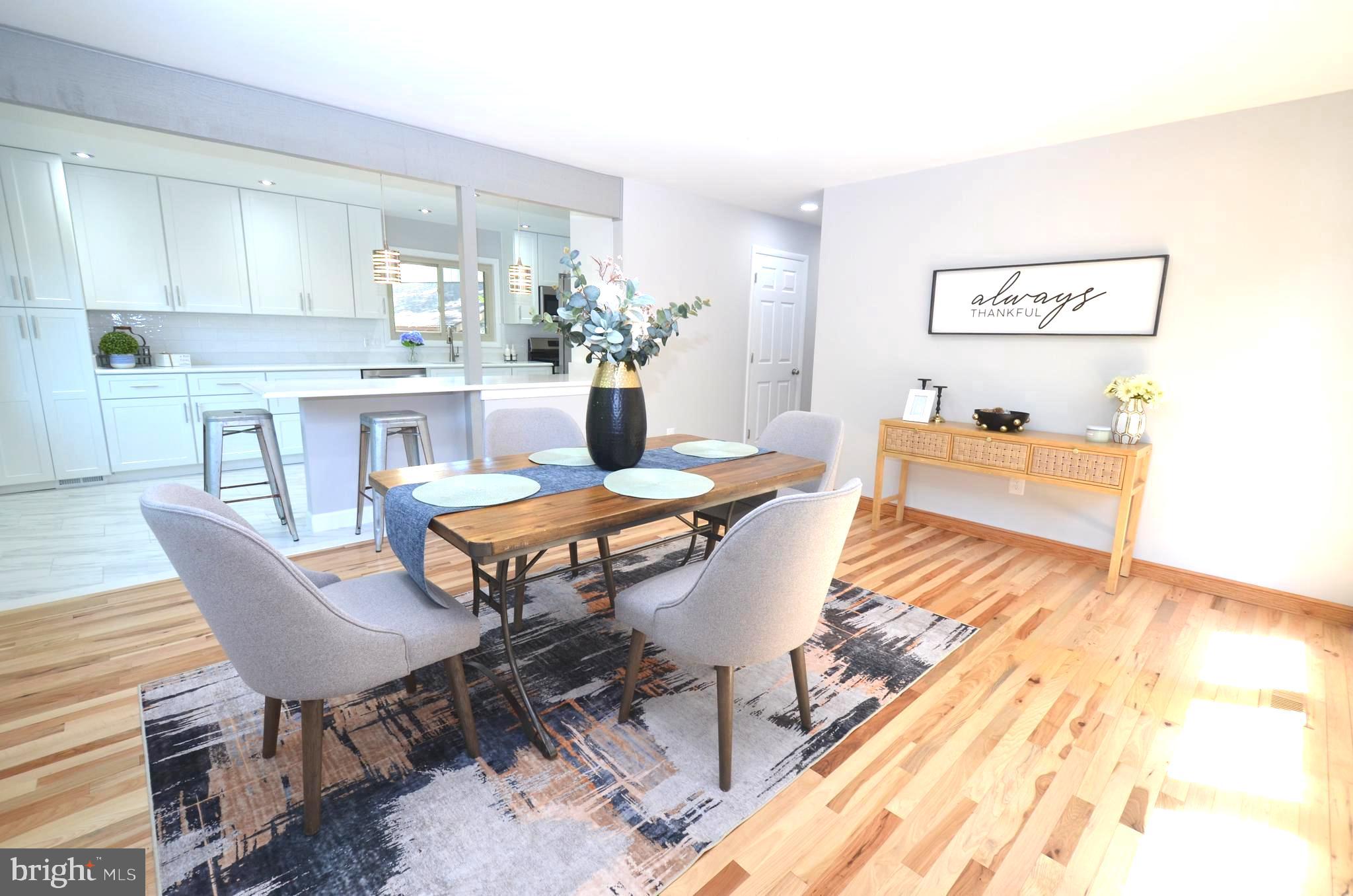 10601 Fiesta Road Fairfax, VA 22032 - Photo 9 of 58 a dining room with furniture and wooden floor