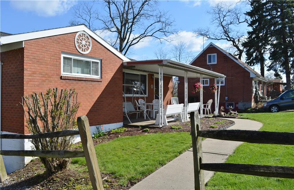 296 Ewings Mill Road Coraopolis, PA 15108 - Photo 2 of 19 Newer concrete sidewalk to lovely covered porch.